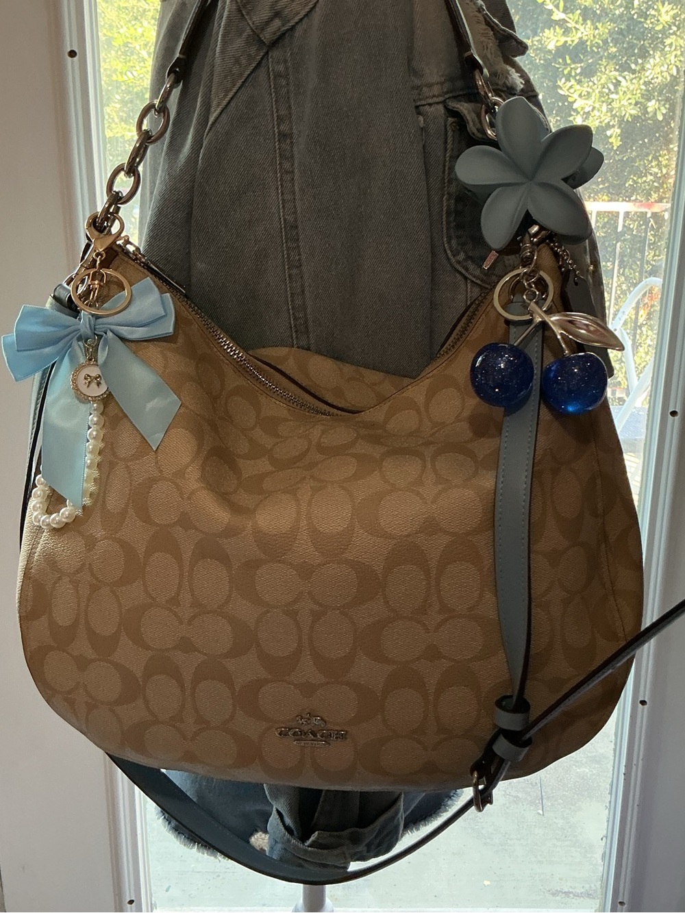 Coach Tan Signature Canvas Hobo with Light Blue Trim and Charms